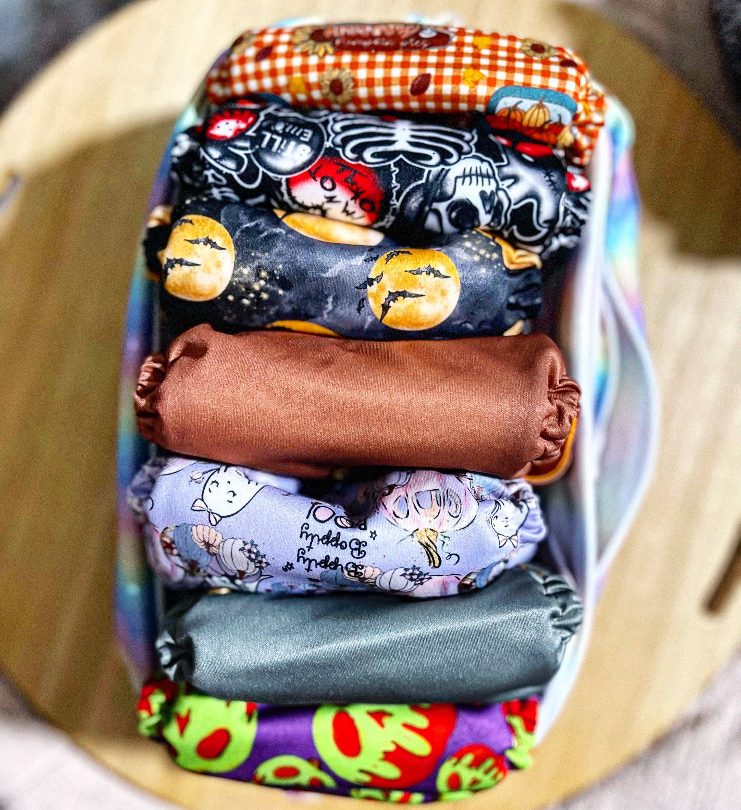 stack of pocket cloth diapers